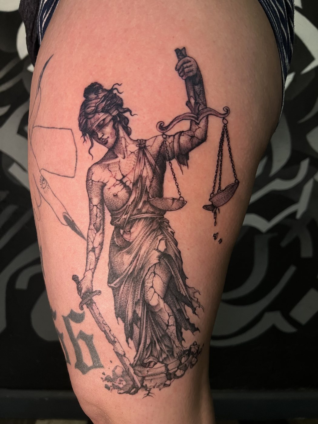 Cracked Lady Justice statue, thigh tattoo by Bri, Kustom Tattoo Club