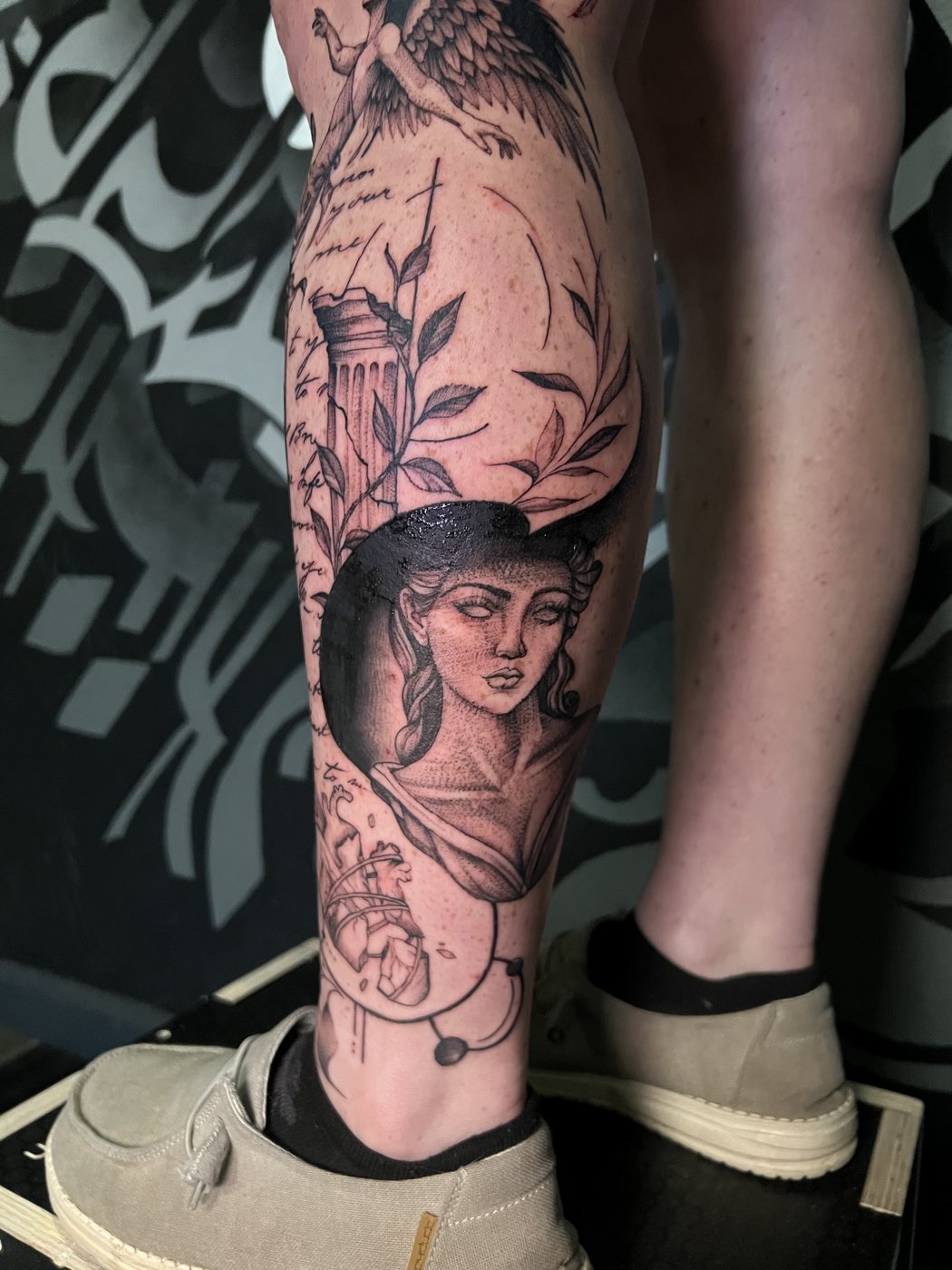 Greek goddess bust with column and laurel, calf tattoo by Bri, Kustom Tattoo Club