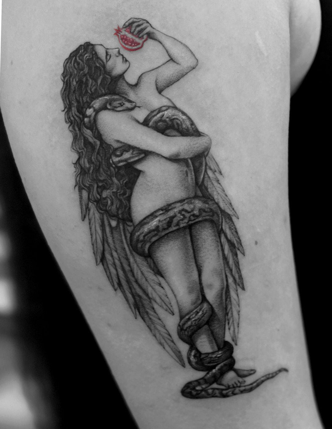 Winged woman with pomegranate and serpent tattoo by Katy, Kustom Tattoo Club