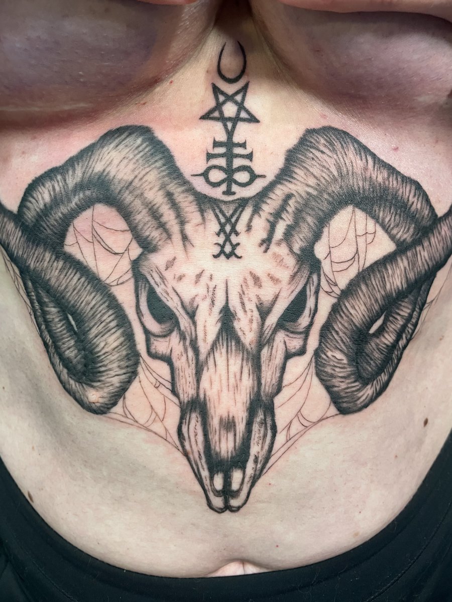 Ram skull with sigils and spiderwebs, sternum tattoo by Lindsay, Kustom Tattoo Club