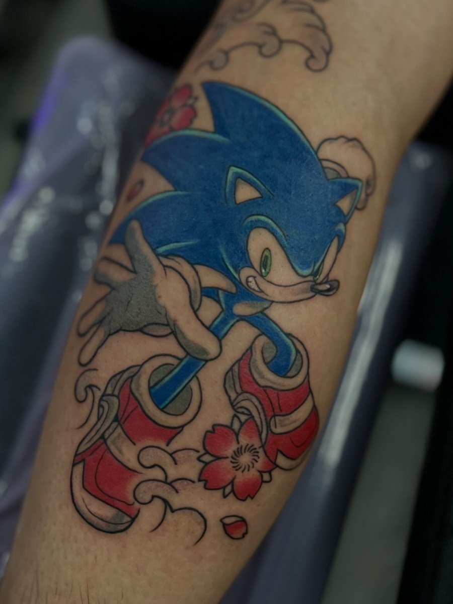 Sonic the Hedgehog with cherry blossoms and waves, tattoo by Trin, Kustom Tattoo Club